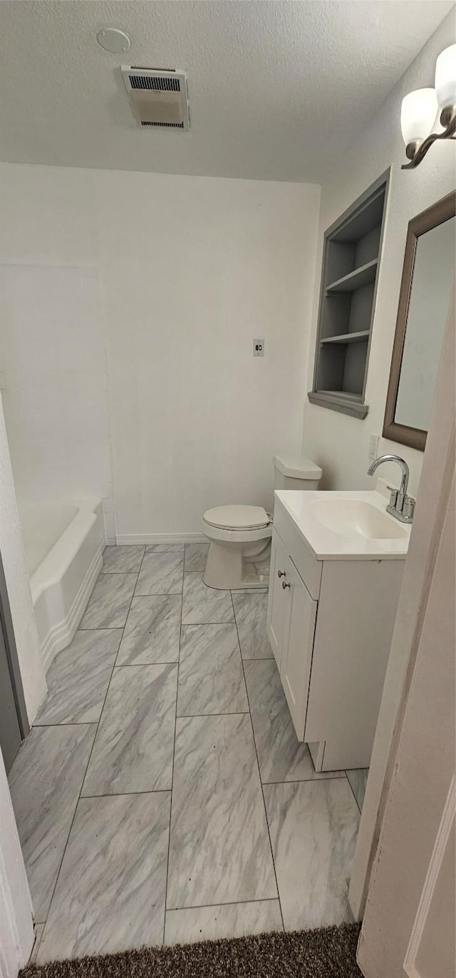 full bath featuring a textured ceiling, marble finish floor, vanity, and visible vents