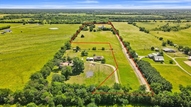 birds eye view of property with a rural view