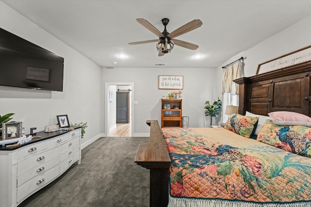 carpeted bedroom featuring a ceiling fan, visible vents, and baseboards