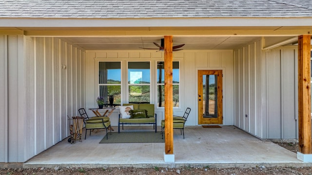 doorway to property with a shingled roof and board and batten siding