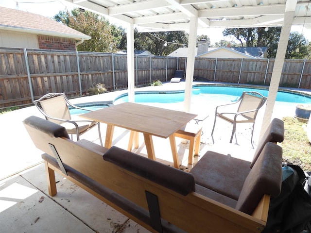 view of swimming pool featuring a fenced in pool, a fenced backyard, and a patio