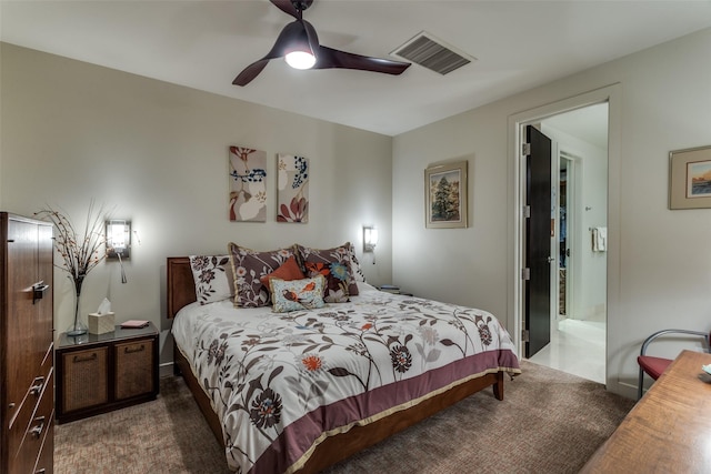 carpeted bedroom featuring visible vents and a ceiling fan