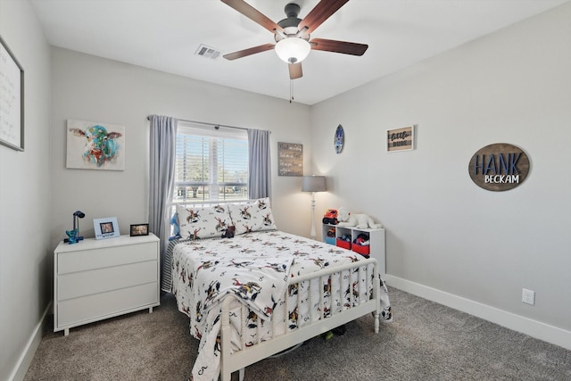 carpeted bedroom with visible vents, ceiling fan, and baseboards