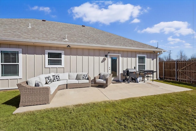 rear view of house featuring board and batten siding, a patio area, fence, and an outdoor living space