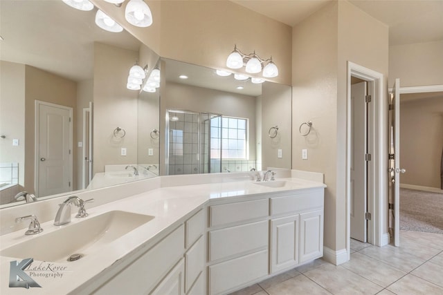 full bath featuring double vanity, a stall shower, tile patterned flooring, and a sink