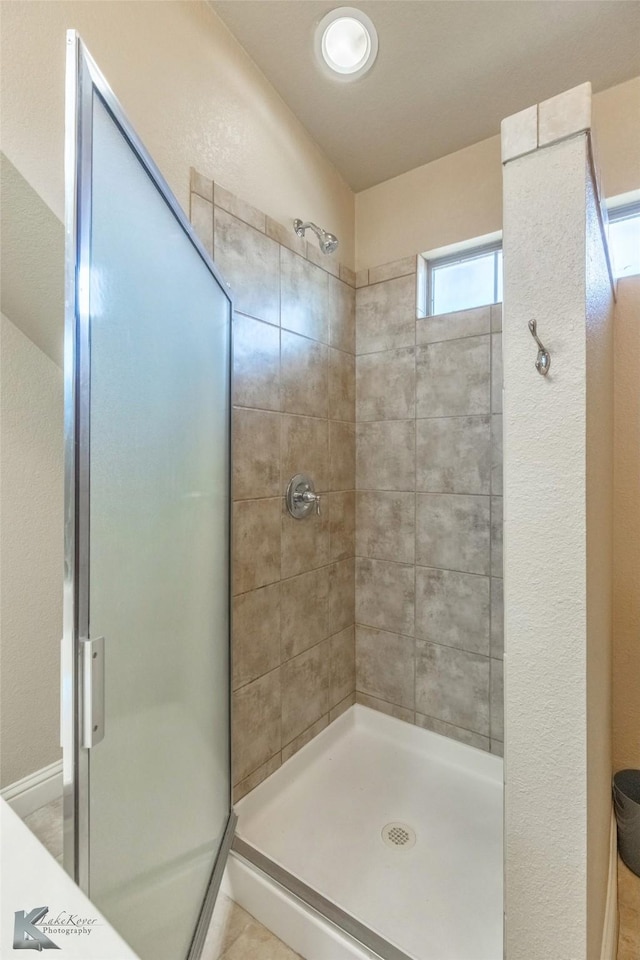 full bathroom with a stall shower