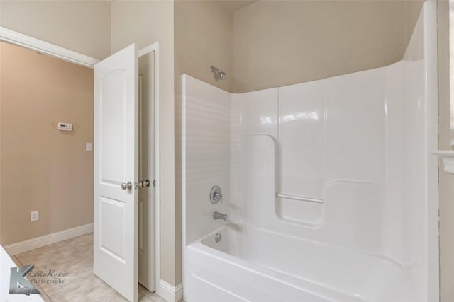 full bathroom with baseboards, shower / bathing tub combination, and tile patterned floors