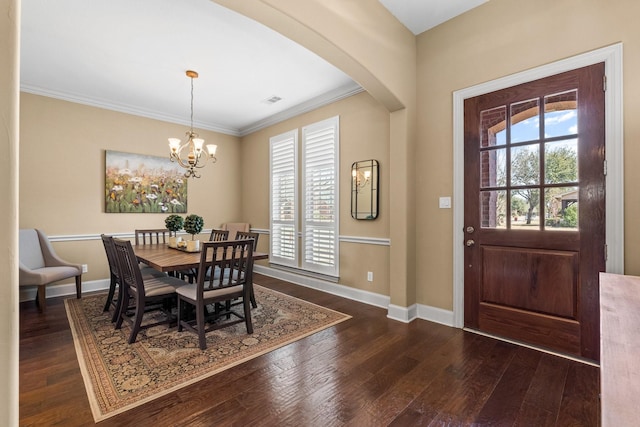 foyer with dark wood-style flooring, a healthy amount of sunlight, and baseboards