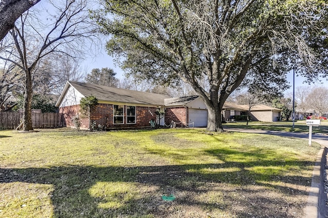 ranch-style house featuring a front lawn, brick siding, fence, and an attached garage