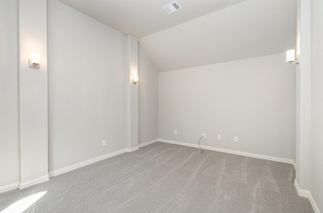 bonus room with lofted ceiling, carpet floors, visible vents, and baseboards