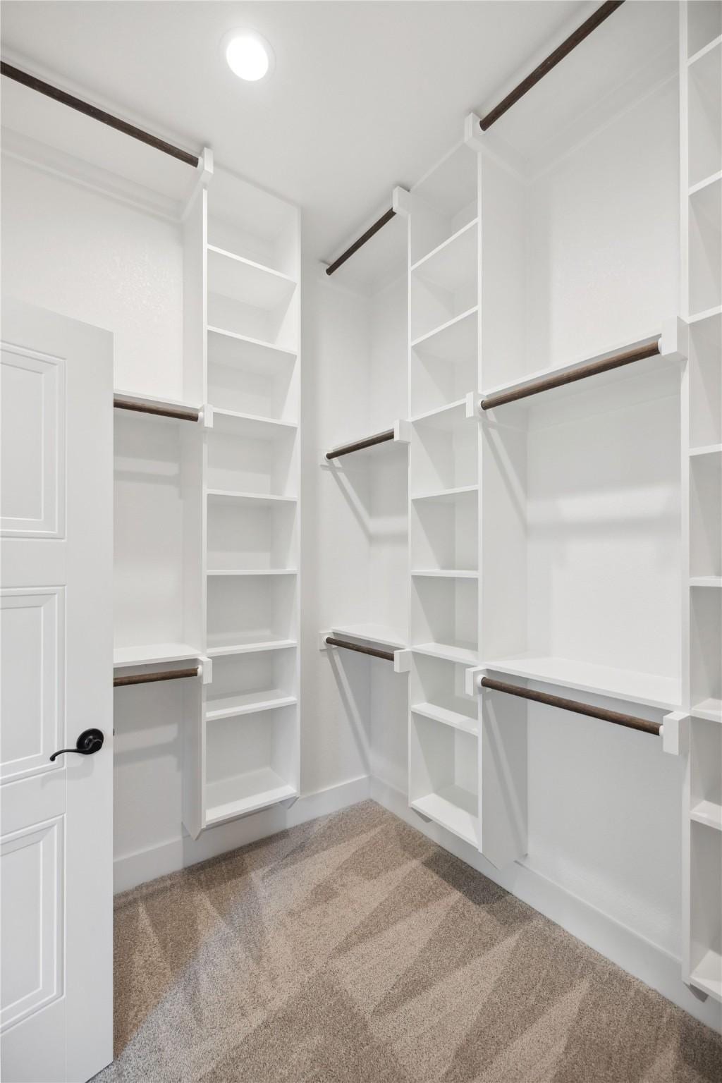 909 Boston Ln, River Oaks, TX 76114 - walk in closet featuring carpet