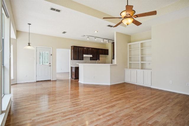 unfurnished living room with light wood finished floors, ceiling fan, visible vents, and baseboards