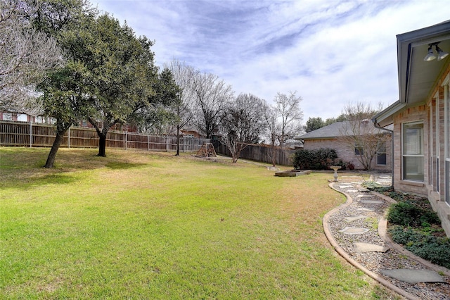 view of yard with a fenced backyard