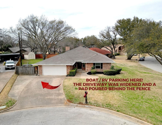 view of front of property with a front lawn, roof with shingles, concrete driveway, a garage, and brick siding