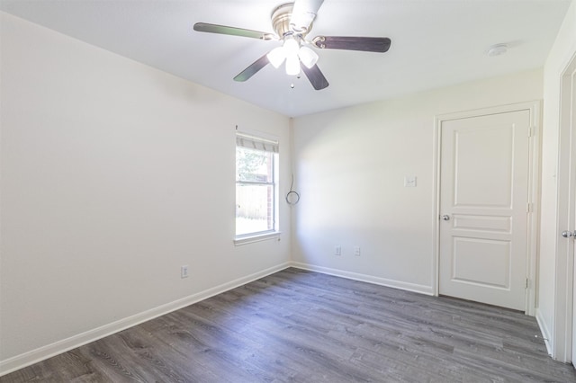 unfurnished room featuring ceiling fan, baseboards, and wood finished floors