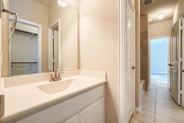 full bathroom with a closet, tile patterned flooring, vanity, and visible vents