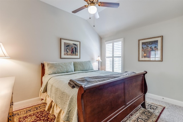 bedroom featuring vaulted ceiling, carpet floors, ceiling fan, and baseboards