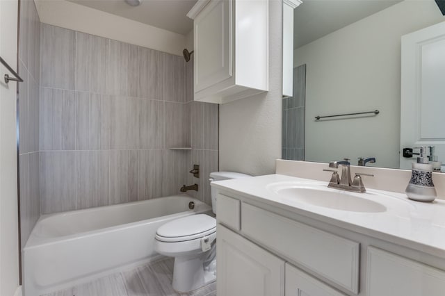 bathroom with toilet, shower / bath combination, and vanity