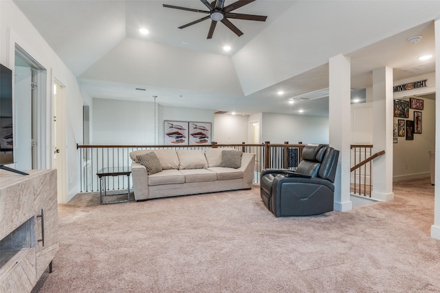 carpeted living room featuring lofted ceiling, a fireplace, a ceiling fan, and recessed lighting