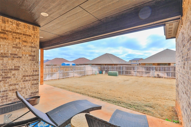 view of patio / terrace featuring a residential view and a fenced backyard