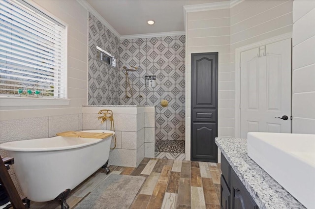 full bathroom with walk in shower, a soaking tub, tile walls, and ornamental molding