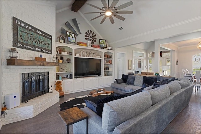 living area featuring a fireplace, high vaulted ceiling, crown molding, and built in shelves