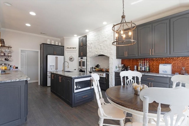 dining area featuring recessed lighting, ornamental molding, and dark wood finished floors