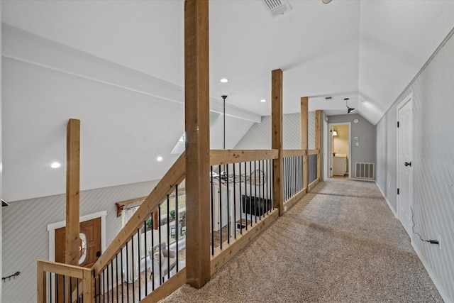 corridor featuring visible vents, vaulted ceiling, carpet flooring, and recessed lighting