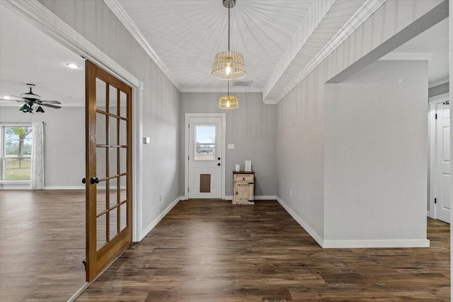 foyer entrance featuring ornamental molding, dark wood-style flooring, visible vents, and baseboards