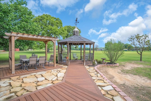 view of home's community featuring outdoor dining area, a yard, a wooden deck, and a gazebo