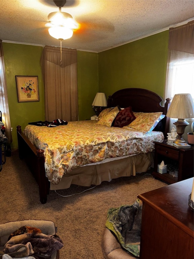 bedroom with crown molding, a textured ceiling, and carpet flooring