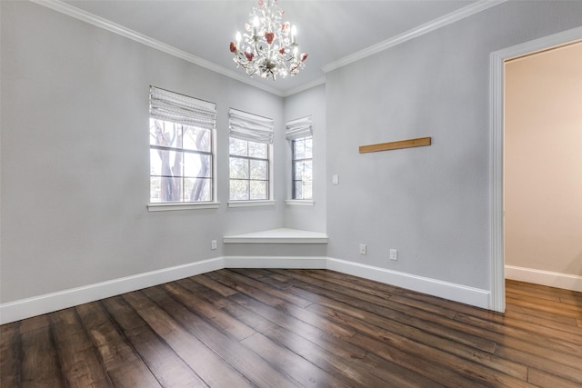 unfurnished room with ornamental molding, a notable chandelier, baseboards, and wood finished floors