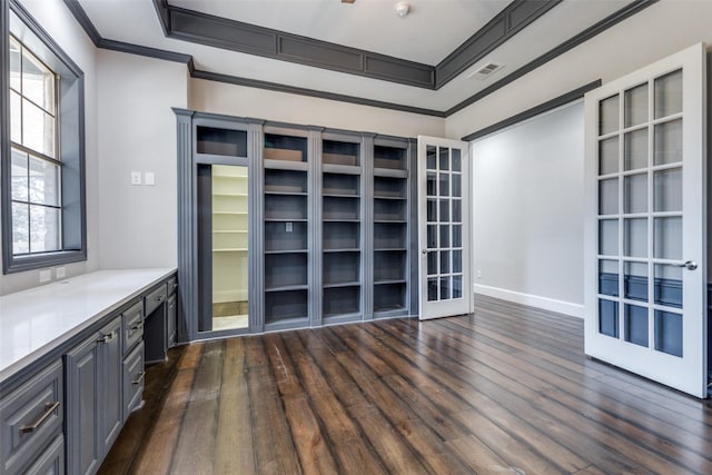 interior space with french doors, ornamental molding, dark wood-type flooring, and visible vents