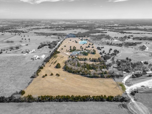 birds eye view of property featuring a rural view