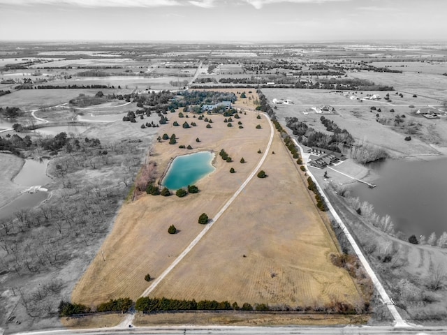 drone / aerial view featuring a rural view and a water view