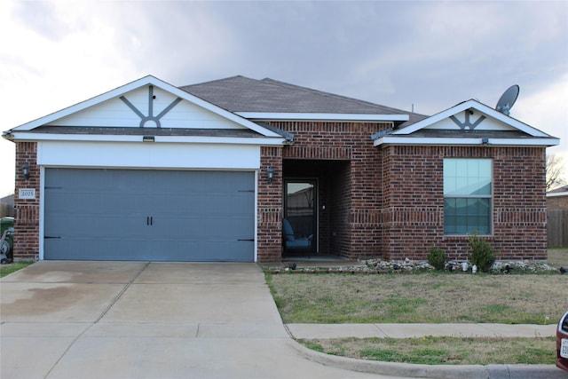 single story home featuring concrete driveway, brick siding, and an attached garage