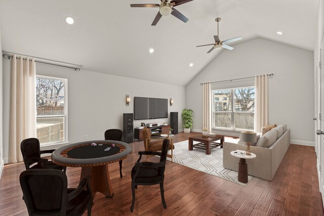 living room with high vaulted ceiling, baseboards, wood finished floors, and recessed lighting