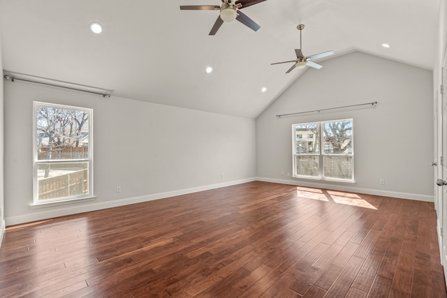 interior space with lofted ceiling, recessed lighting, wood finished floors, and baseboards