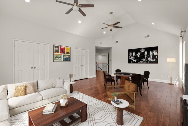 living area featuring baseboards, visible vents, dark wood-type flooring, high vaulted ceiling, and recessed lighting