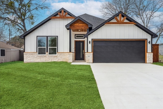 modern inspired farmhouse featuring a garage, driveway, roof with shingles, board and batten siding, and a front yard