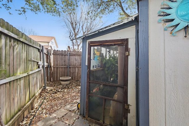 view of outdoor structure with an outbuilding and a fenced backyard