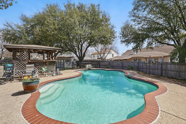 view of pool featuring a gazebo, a fenced backyard, a fenced in pool, and a patio