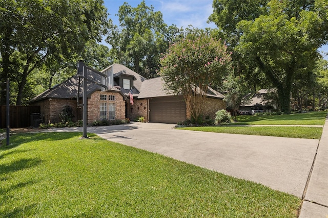 view of front of house featuring driveway, brick siding, an attached garage, and a front yard