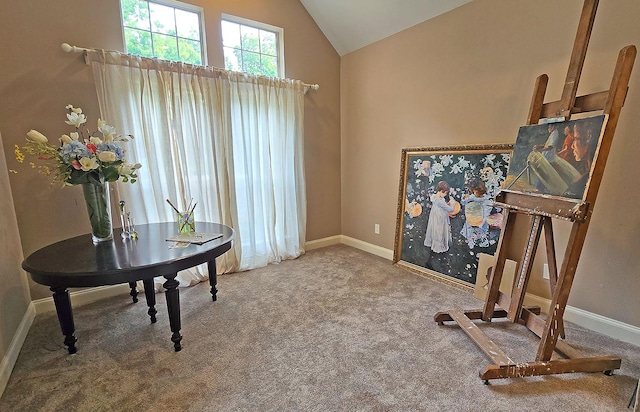 living area with lofted ceiling, baseboards, and carpet flooring