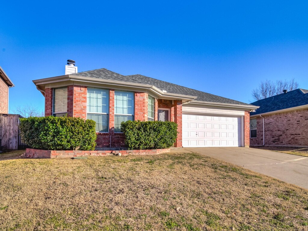 3644 Desert Mesa Rd, Fort Worth, TX 76262 - ranch-style home with driveway, brick siding, a chimney, and a front yard