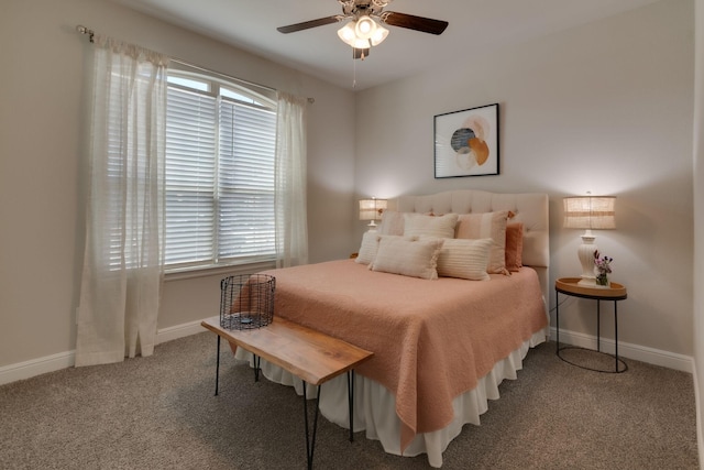 carpeted bedroom with ceiling fan and baseboards