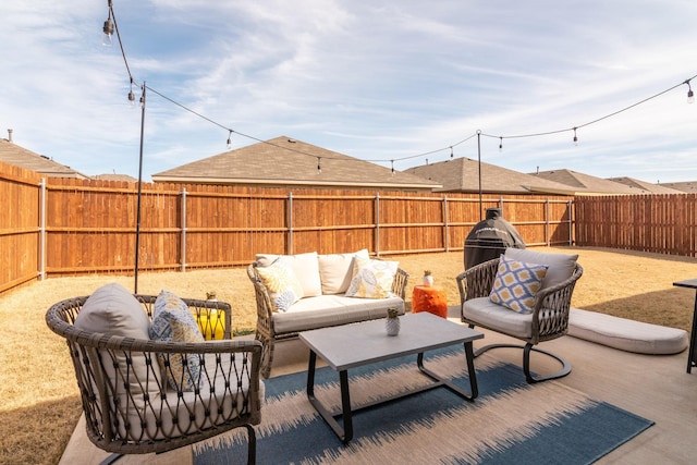 view of patio with a fenced backyard and an outdoor living space