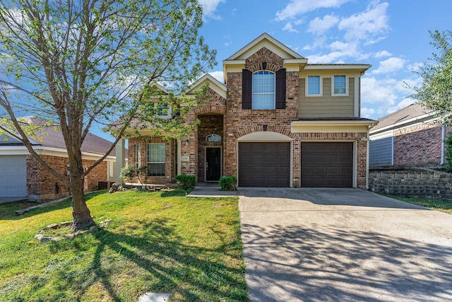 traditional-style home with an attached garage, concrete driveway, brick siding, and a front yard