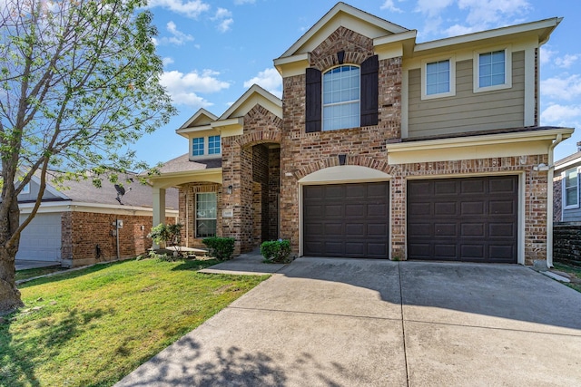 traditional-style home featuring an attached garage, a front lawn, concrete driveway, and brick siding