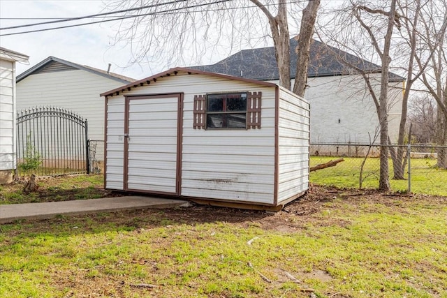 view of shed featuring fence